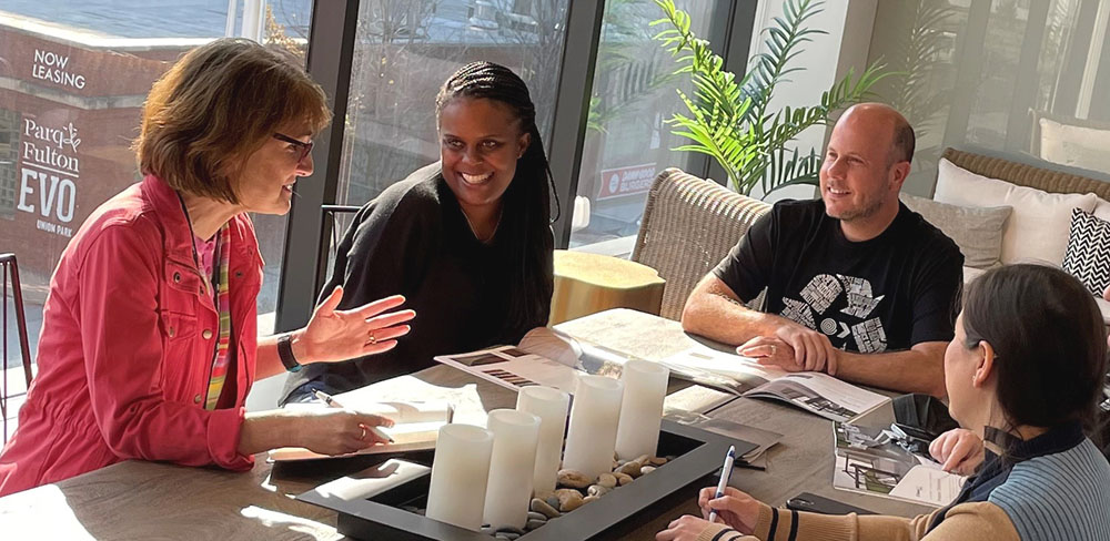 A team of AZEK employees chat during a meeting at the corporate headquarters in Chicago